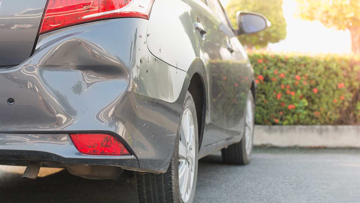 Trunk of car with dent